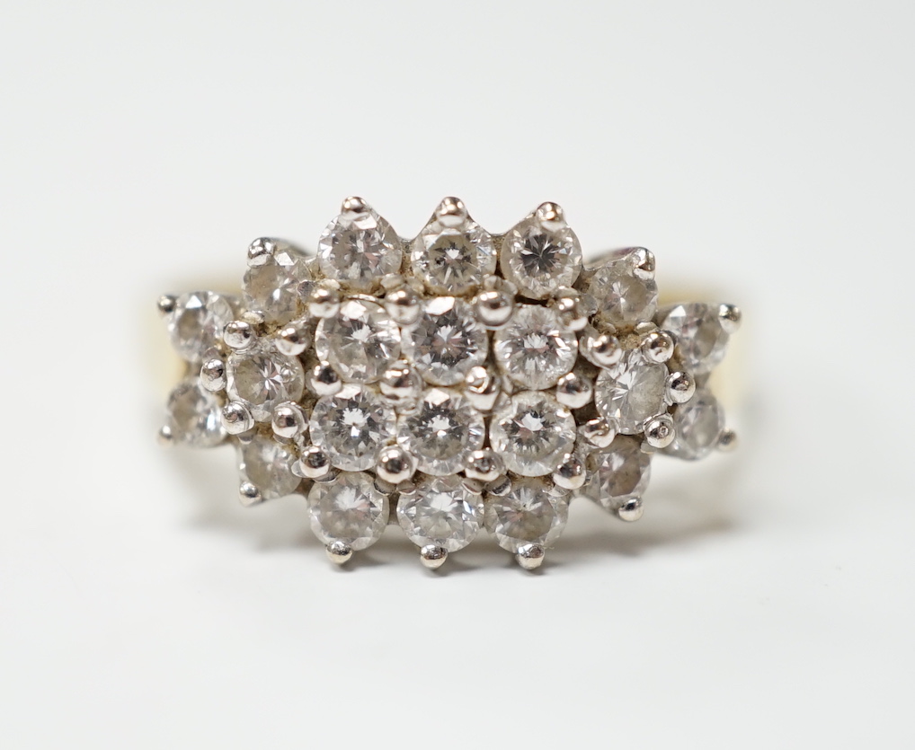 A modern 18ct gold and diamond cluster set dress ring, size P, gross weight 4.4 grams.